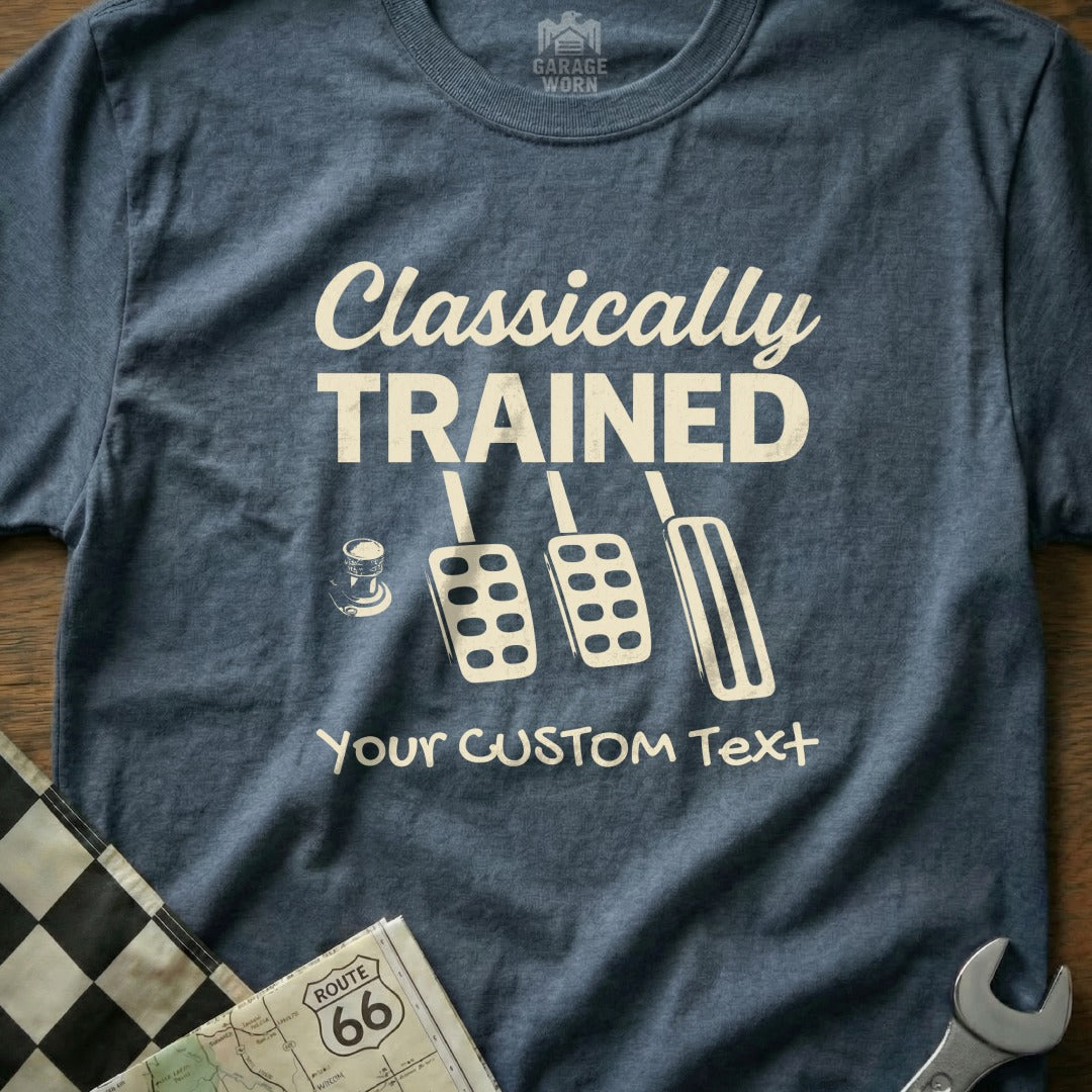 "Classically Trained" text with three pedals and a coffee cup on a blue shirt.