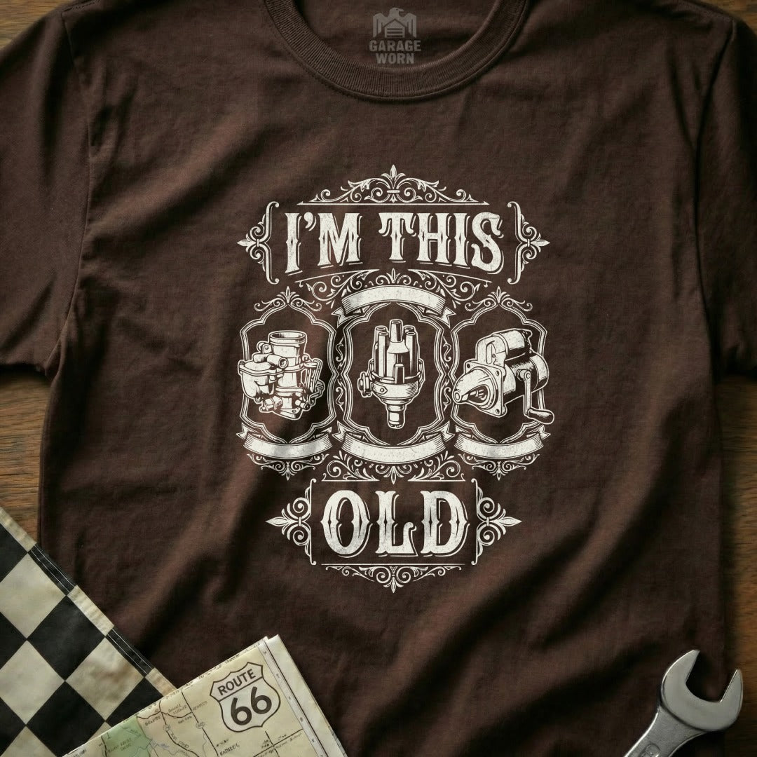 Brown t-shirt with "I'm This Old" and vintage car part illustrations.