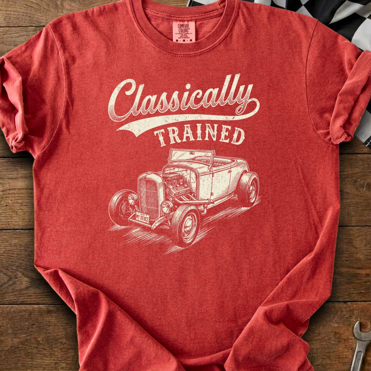 Red t-shirt with cream graphic of a classic convertible car and "Classically TRAINED" text.