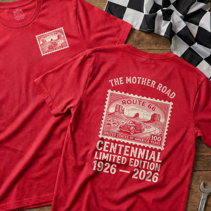 Red t-shirt with Route 66 Centennial design featuring a postage stamp and desert landscape.