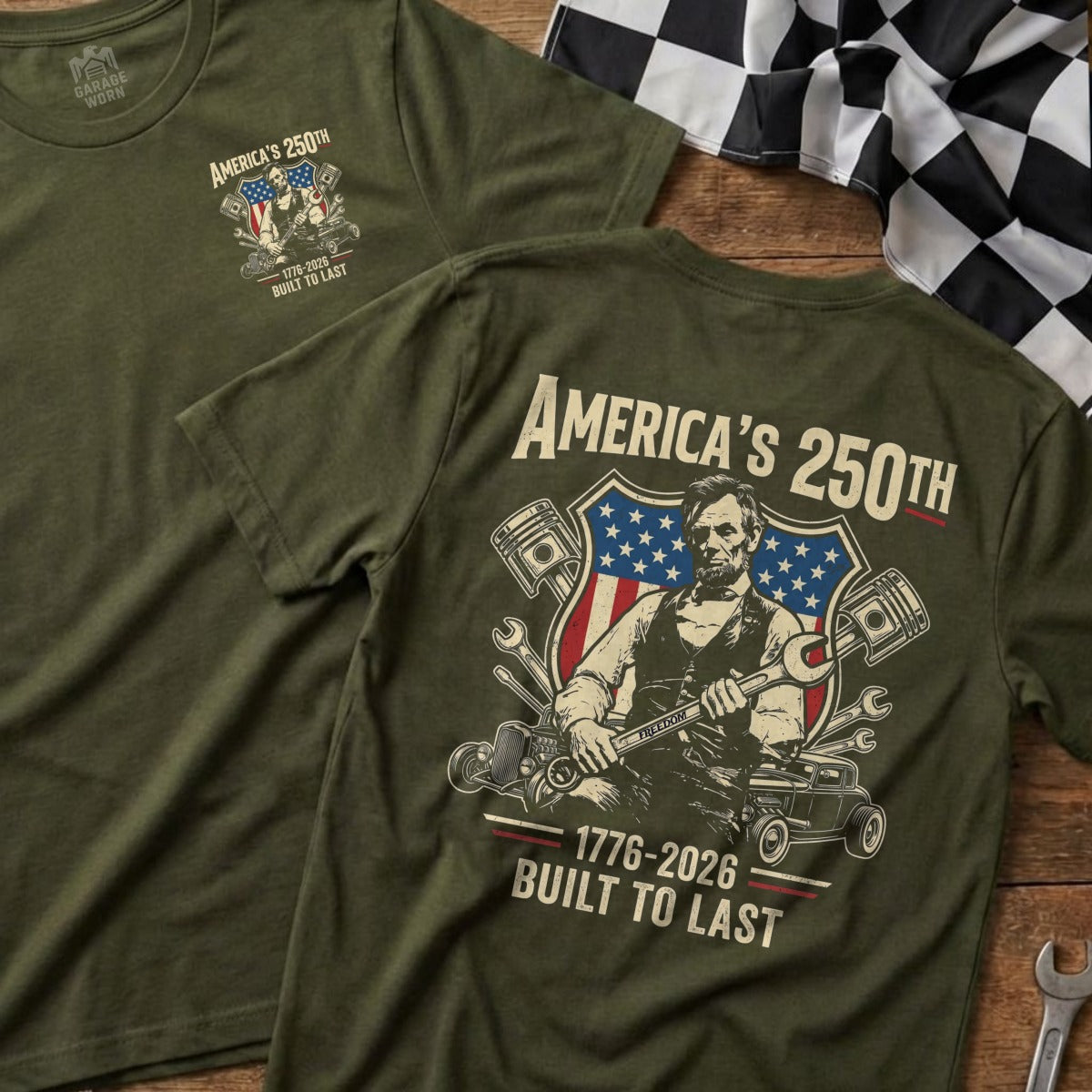 Olive green t-shirt with Abraham Lincoln, American flag, and pistons graphic.