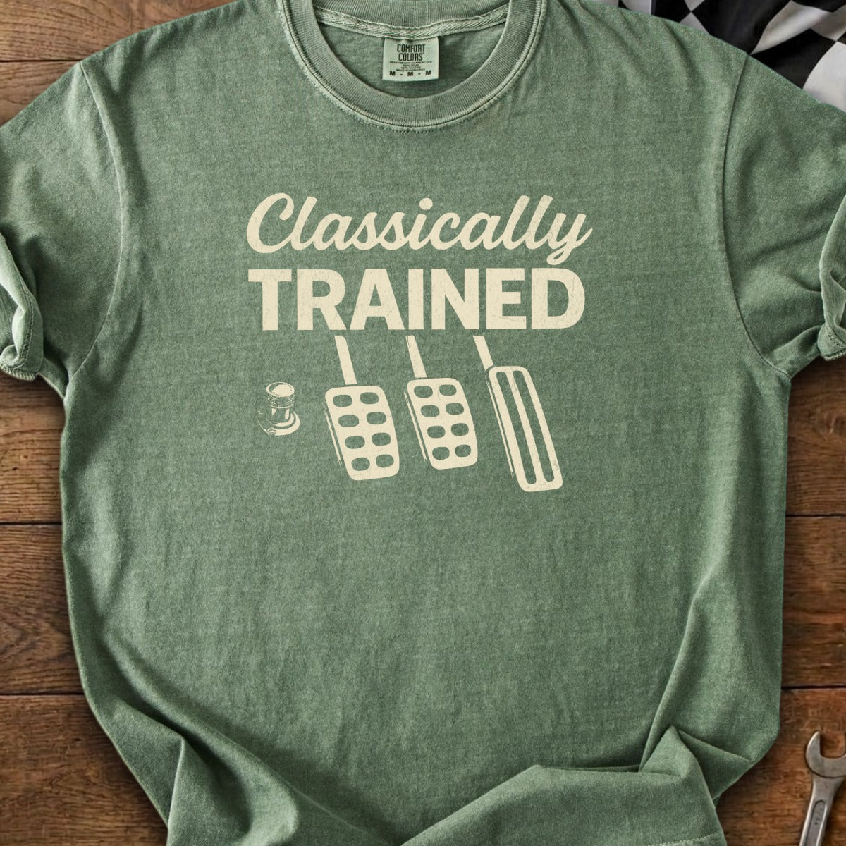 Green t-shirt with "Classically TRAINED" and three pedals design.