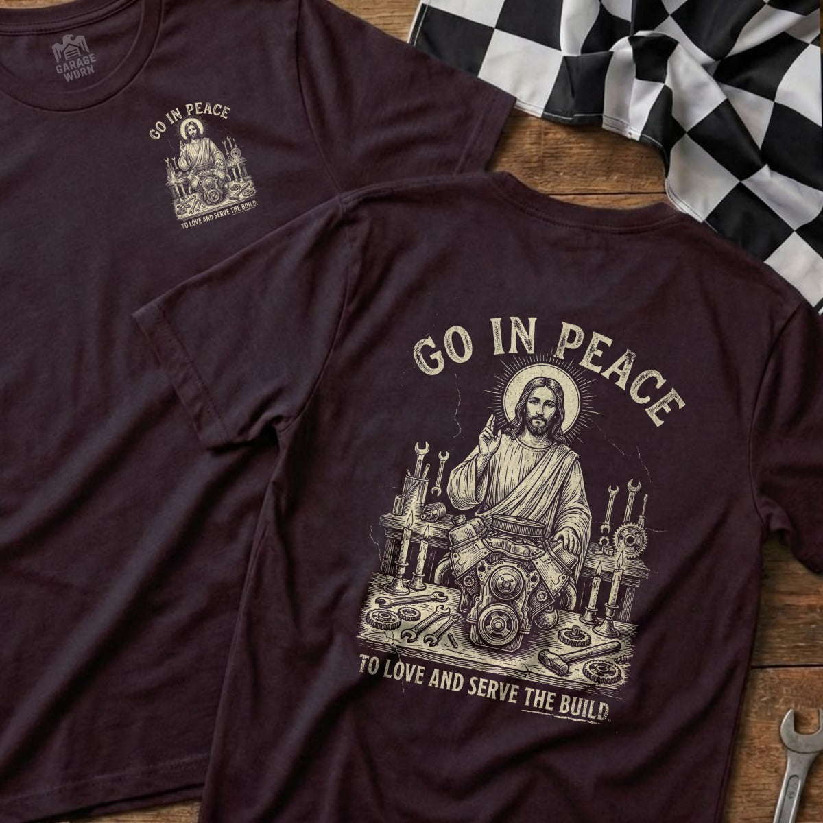 Dark t-shirt with "GO IN PEACE" and Jesus working on an engine.