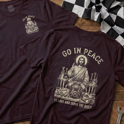 Dark t-shirt with "GO IN PEACE" and Jesus working on an engine.