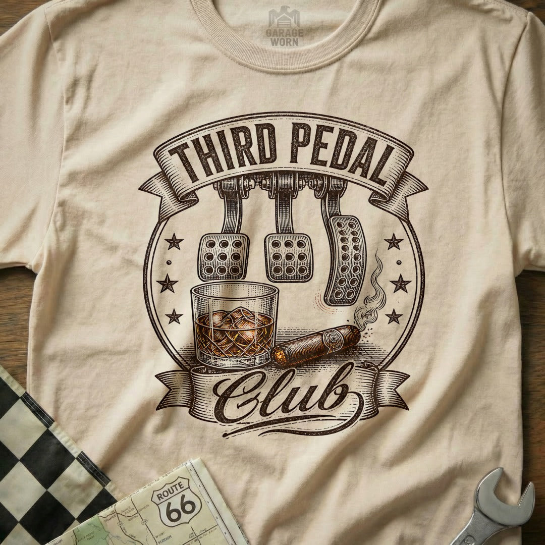 T-shirt graphic with "Third Pedal Club," car pedals, whiskey, and cigar.