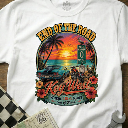 Key West End of the Road graphic with classic car, motorcycle, sunset, and "Where US-1 Runs Out of Road" text.