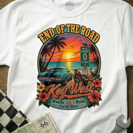 Key West End of the Road graphic with classic car, motorcycle, sunset, and "Where US-1 Runs Out of Road" text.