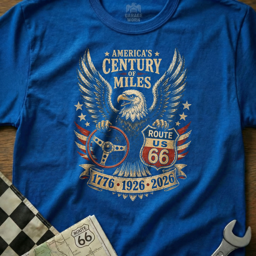 Blue t-shirt with eagle, Route 66 shield, steering wheel, and dates 1776-1926-2026.