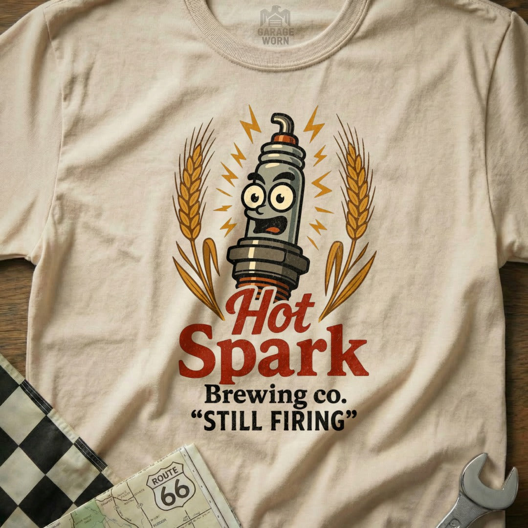 Hot Spark Brewing Co. "Still Firing" t-shirt with spark plug graphic.