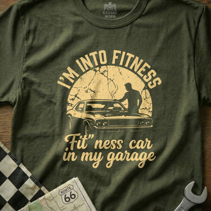 Olive t-shirt with "I'm Into Fitness, Fit" ness car in my garage" text and car graphic.