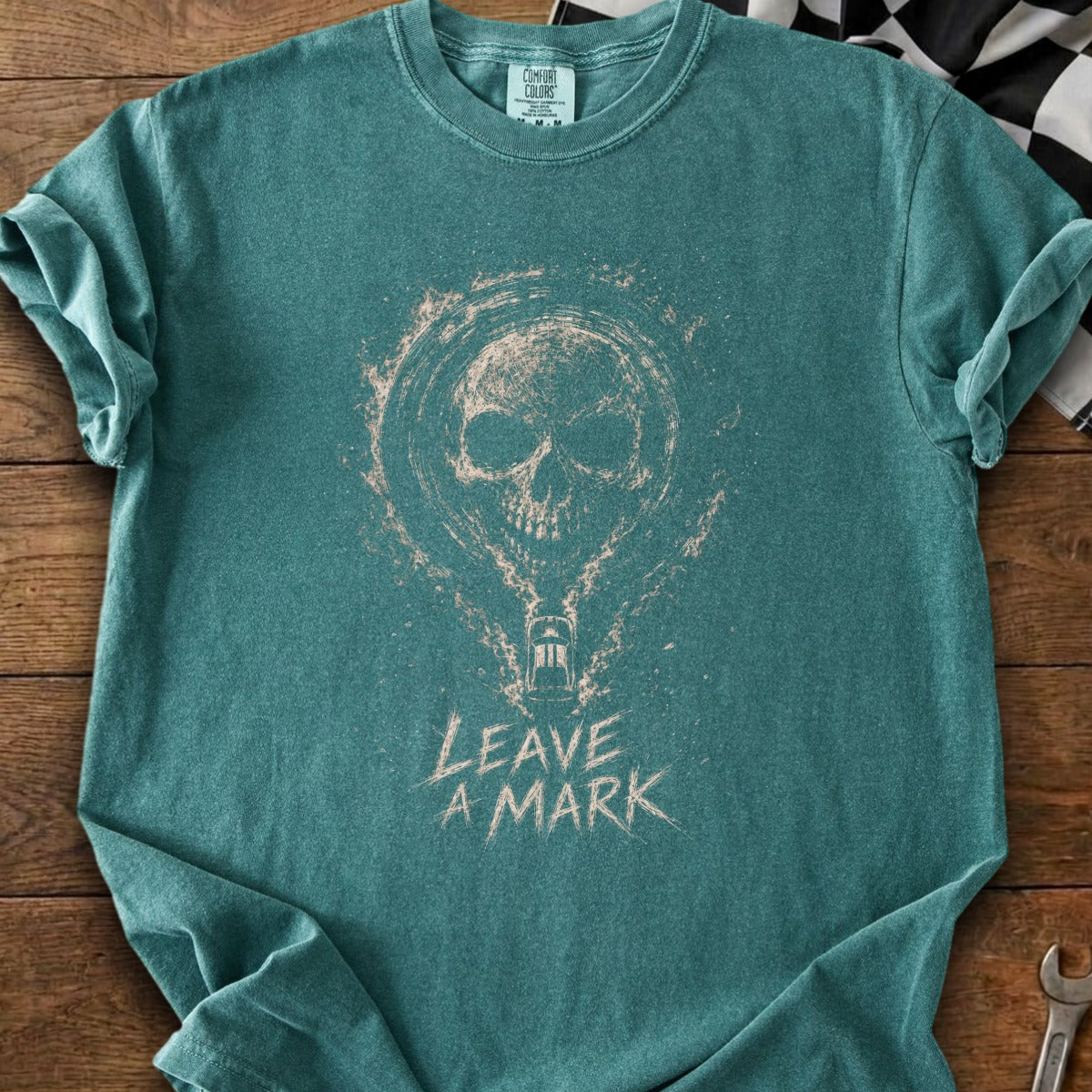Teal t-shirt with a distressed skull graphic and "Leave a Mark" text.