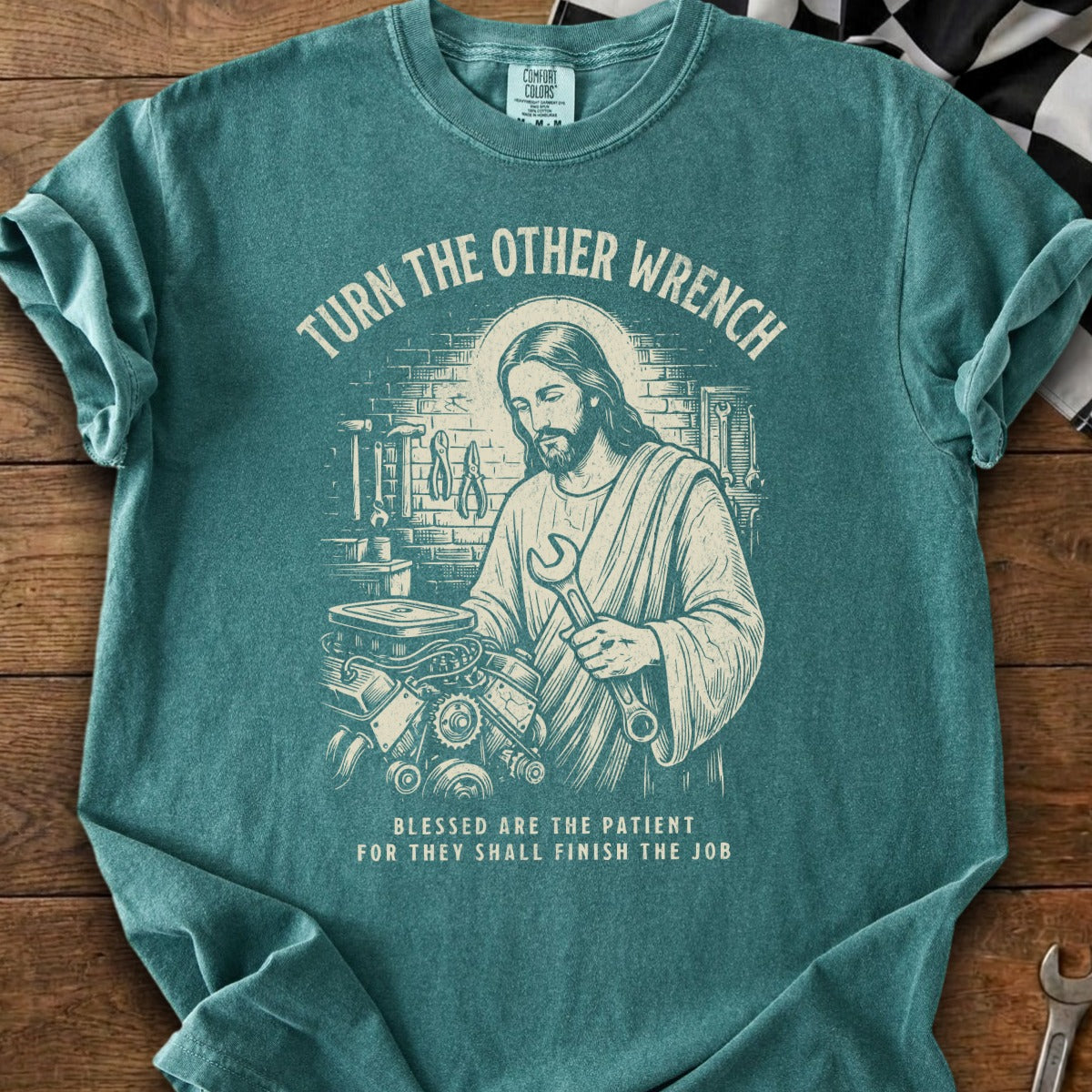 Jesus holding a wrench over an engine, with text "Turn the other wrench".