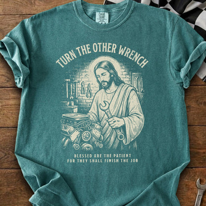 Jesus holding a wrench over an engine, with text "Turn the other wrench".