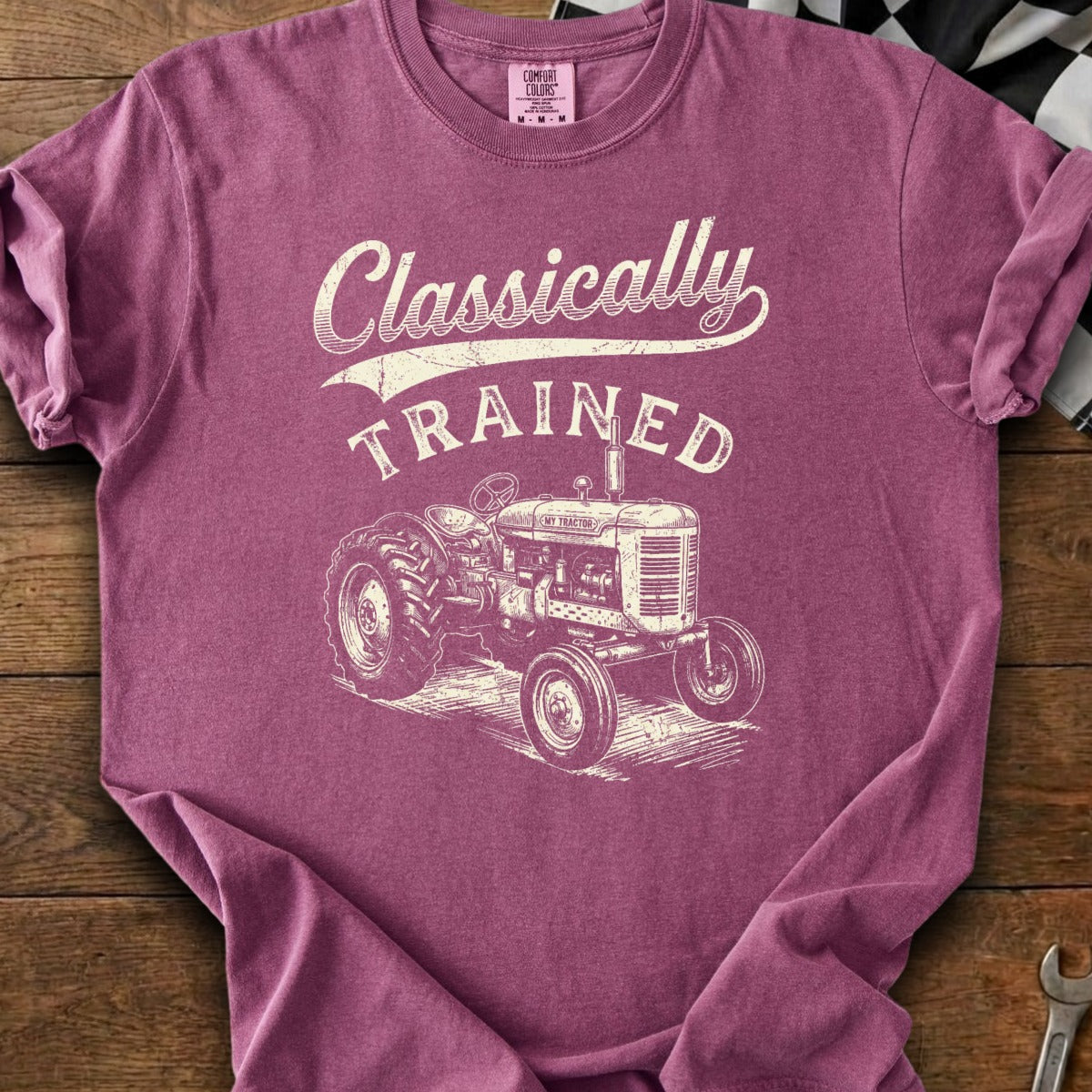 T-shirt with distressed graphic of a vintage tractor and "Classically Trained" text