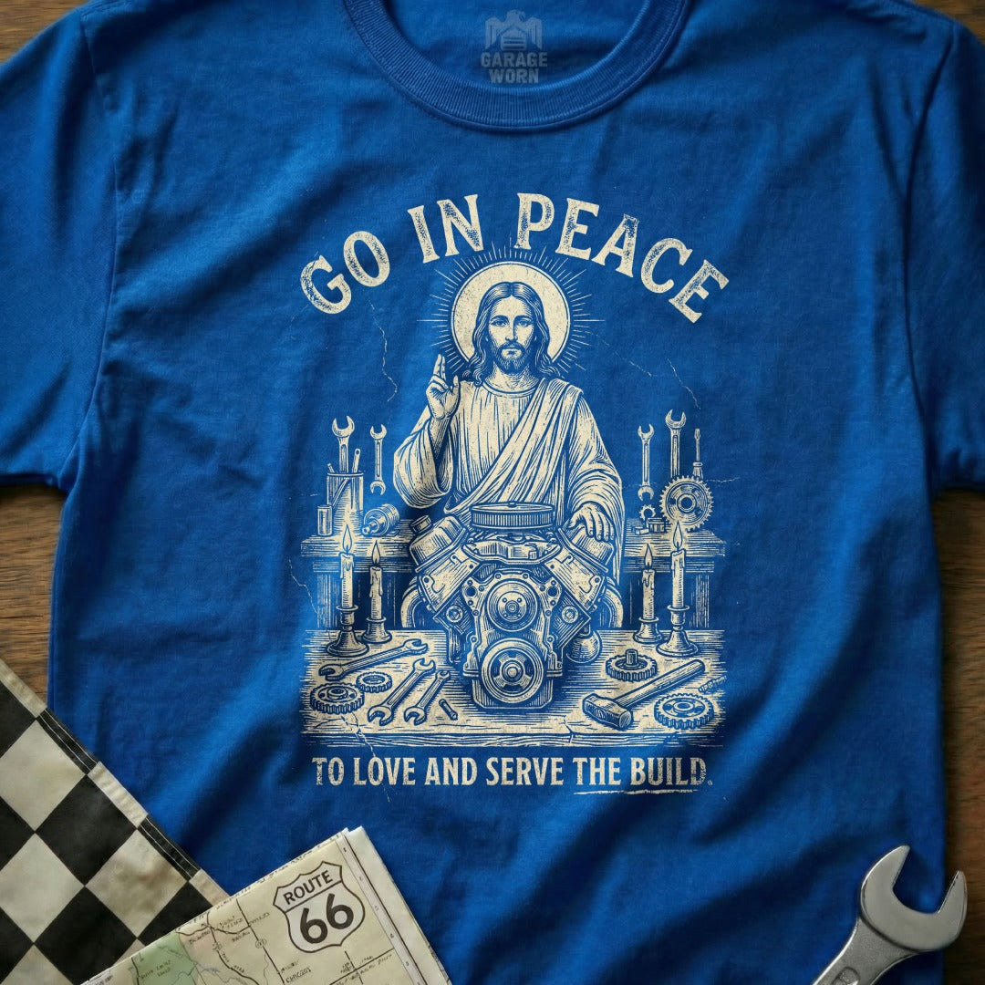 Jesus with engine parts and tools, text "Go in Peace to Love and Serve the Build".