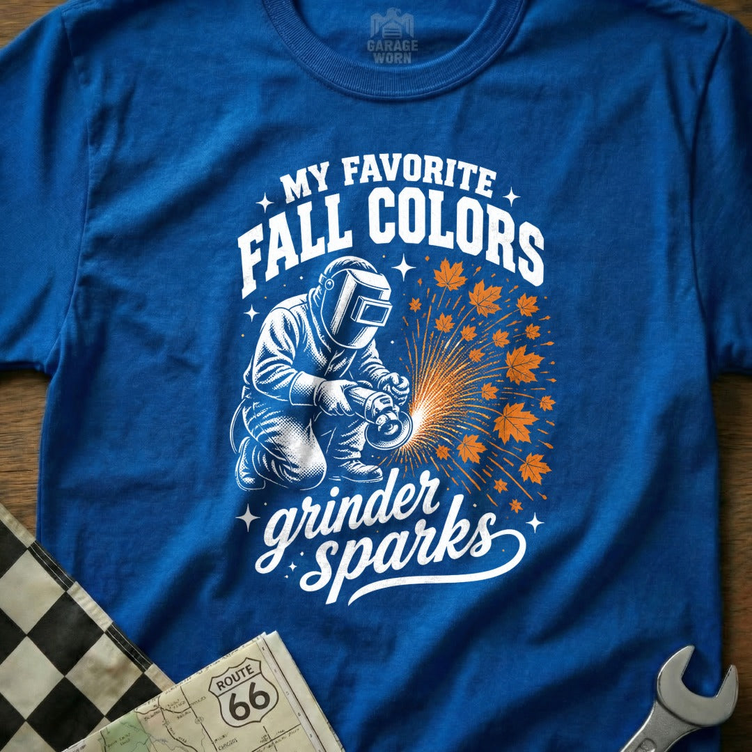 Blue t-shirt with a graphic of a welder and "My Favorite Fall Colors Grinder Sparks" text.