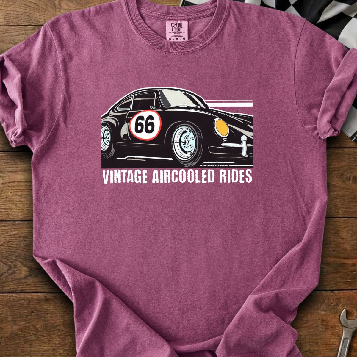 Black car with number 66 and "VINTAGE AIRCOOLED RIDES" text on a maroon t-shirt.