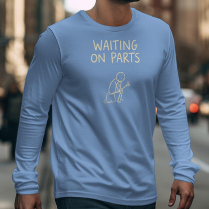 Light blue long-sleeve shirt with "WAITING ON PARTS" text and stick figure holding a screw.