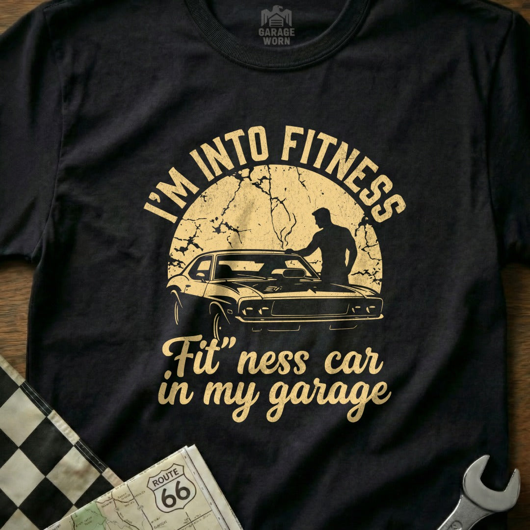 T-shirt with "I'm Into Fitness, Fit 'ness car in my garage" and car graphic.