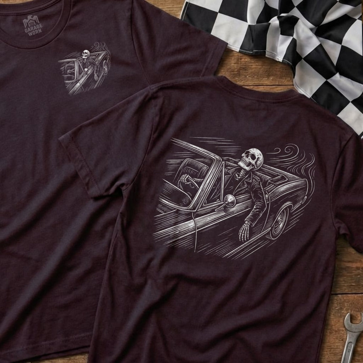 T-shirt graphic with skeleton driving a vintage car, smoke trailing.