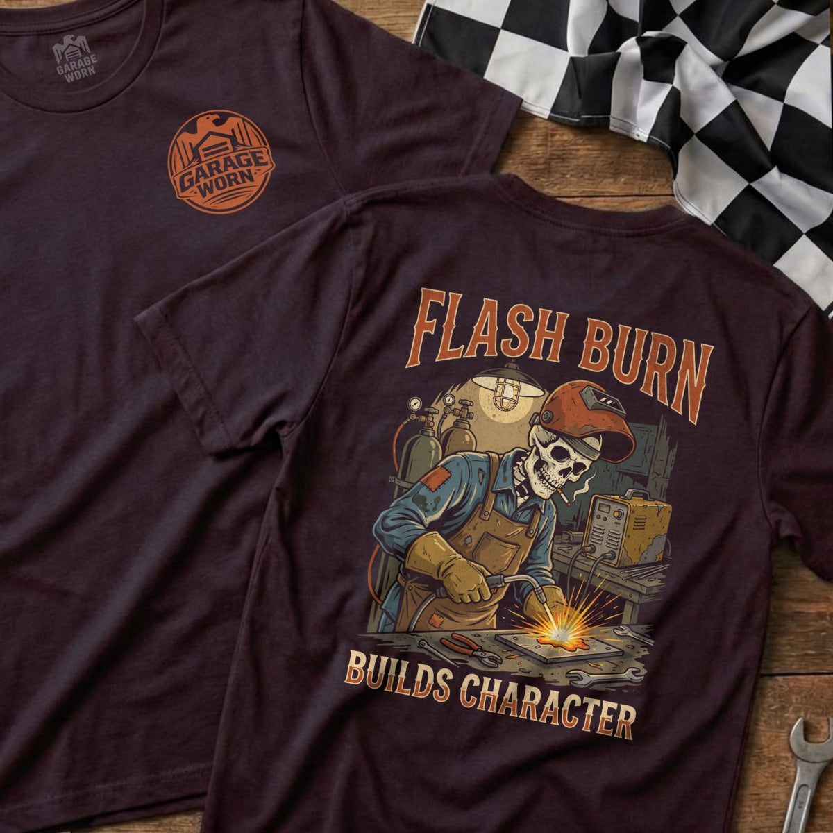 T-shirt with "Flash Burn Builds Character" graphic of skeleton welder.