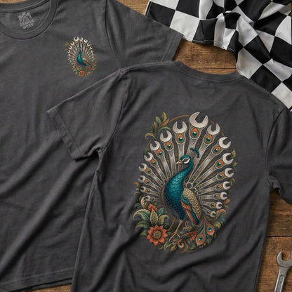 Dark gray t-shirt with a peacock graphic made of wrenches and floral accents.