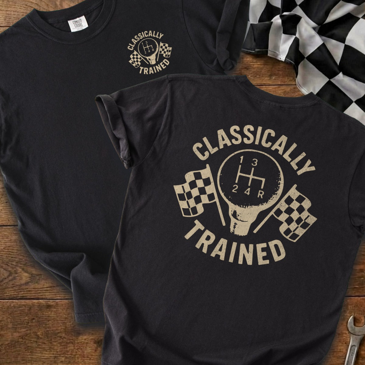 Dark t-shirt featuring a vintage gear shift design with checkered flags and text.