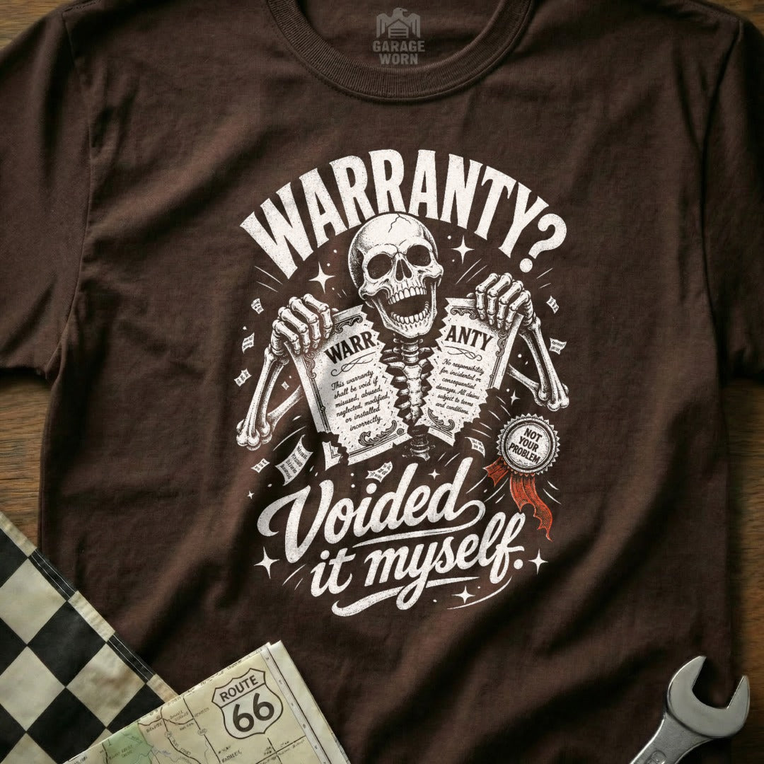 Brown t-shirt graphic: skeleton holds torn warranty papers stating "Voided it myself."
