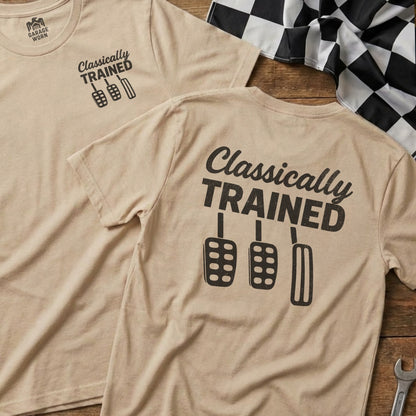 Two tan t-shirts with "Classically Trained" and pedal graphics.