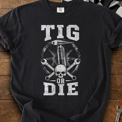 Black t-shirt with white distressed graphic of a TIG torch, skull, wrenches, and text.
