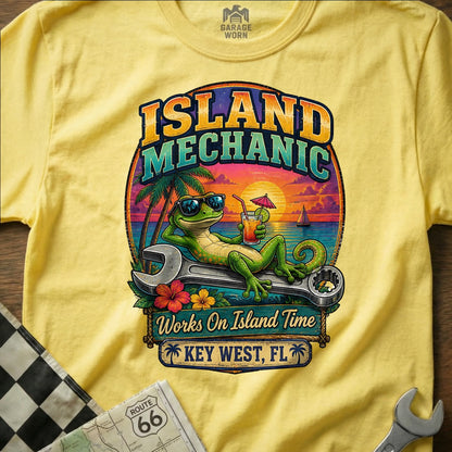 Yellow t-shirt with "Island Mechanic, Works On Island Time, Key West, FL" text and a gecko lounging on a wrench.