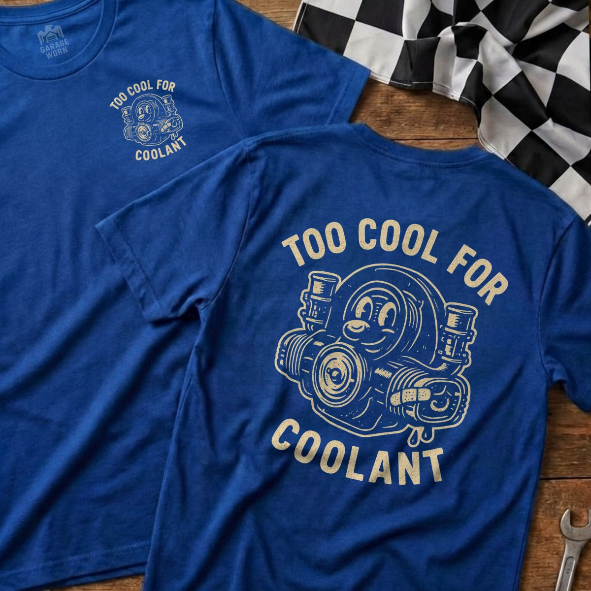 Blue t-shirt with cartoon engine and text "TOO COOL FOR COOLANT".