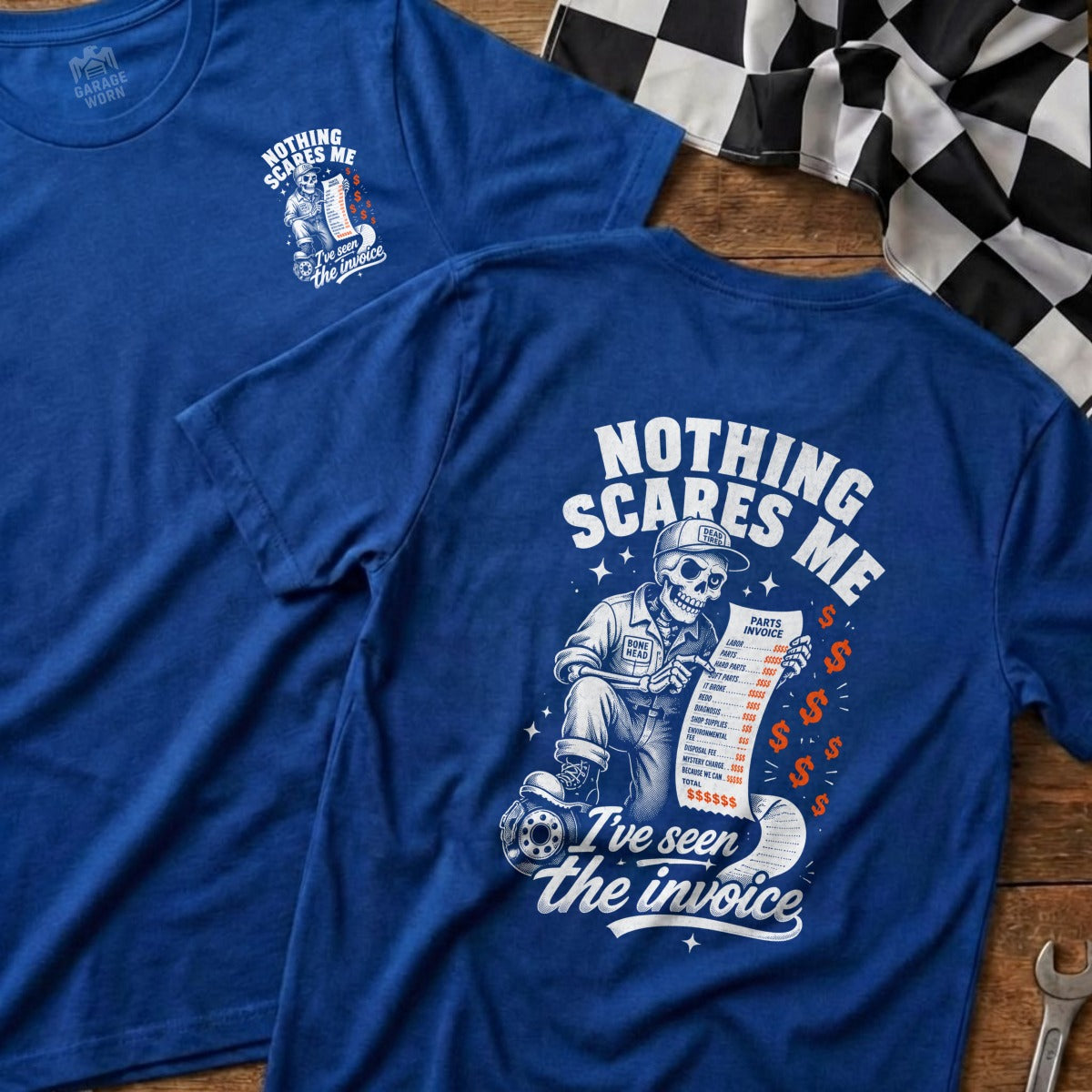 Blue t-shirt with skeleton mechanic holding invoice; text reads "Nothing scares me, I've seen the invoice."