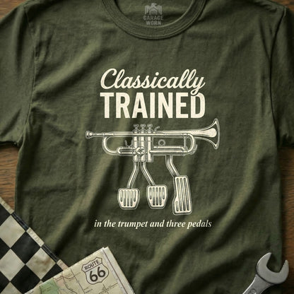 Olive green t-shirt with "Classically Trained in the trumpet and three pedals" text and trumpet image.