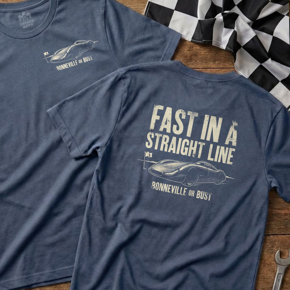 Blue t-shirt with a graphic of a race car and "Fast in a Straight Line" text.