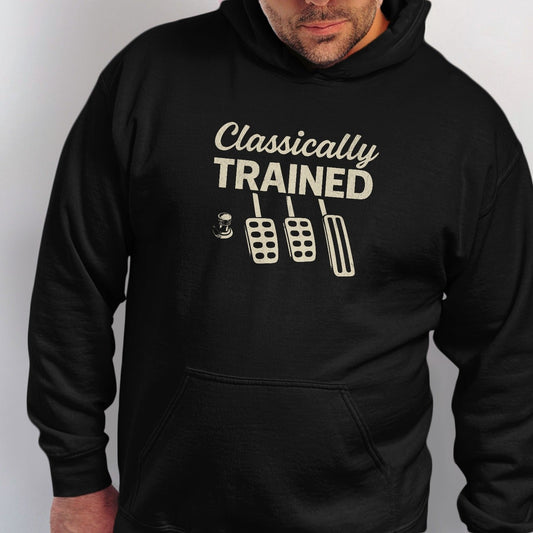 Black hoodie with "Classically TRAINED" text and manual car pedals graphic.