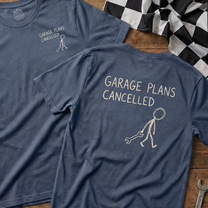 Blue t-shirts with "GARAGE PLANS CANCELLED" and a stick figure with a wrench.
