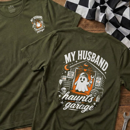 Green t-shirt with ghost in garage graphic and "My Husband Haunts the Garage" text.