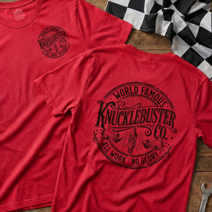 Red t-shirt with "World Famous Knucklebuster" text and gear logo.