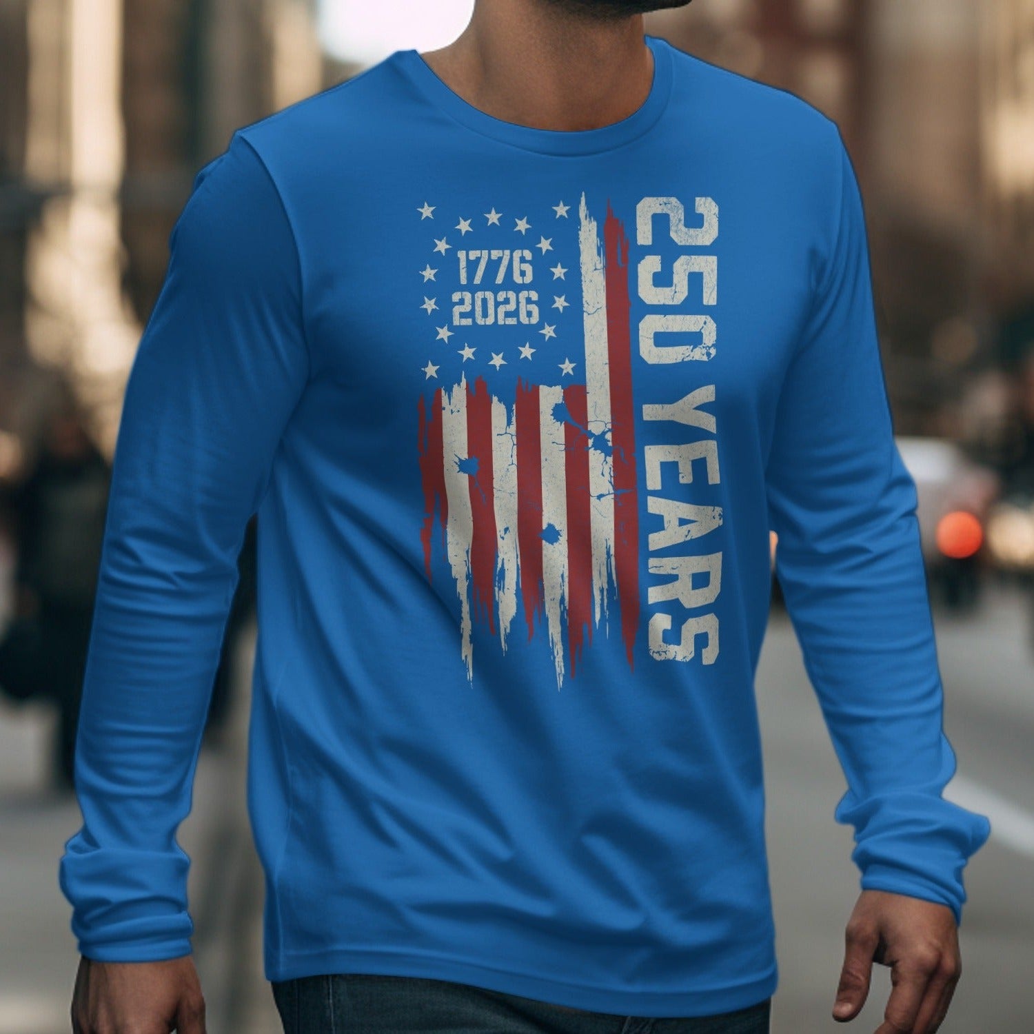 Blue long sleeve shirt with distressed American flag and "250 YEARS 1776 2026" text.