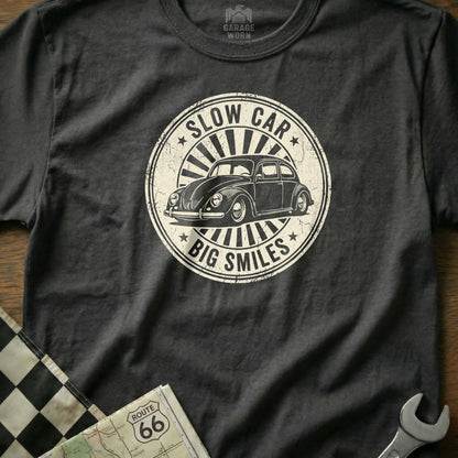 Dark gray t-shirt with "Slow Car, Big Smiles" text and a vintage Volkswagen Beetle.