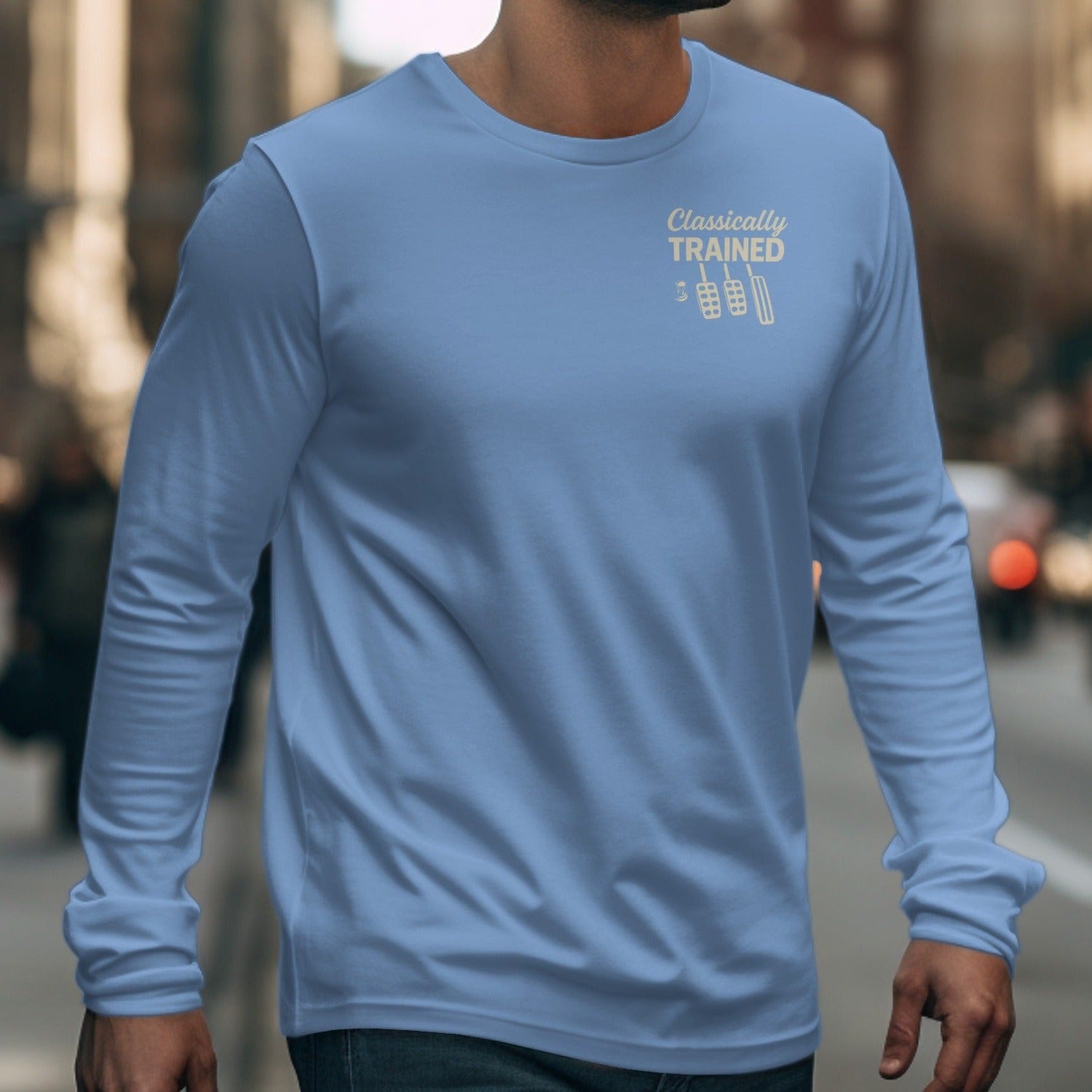 Light blue long-sleeve shirt with "Classically TRAINED" and clutch pedals graphic.
