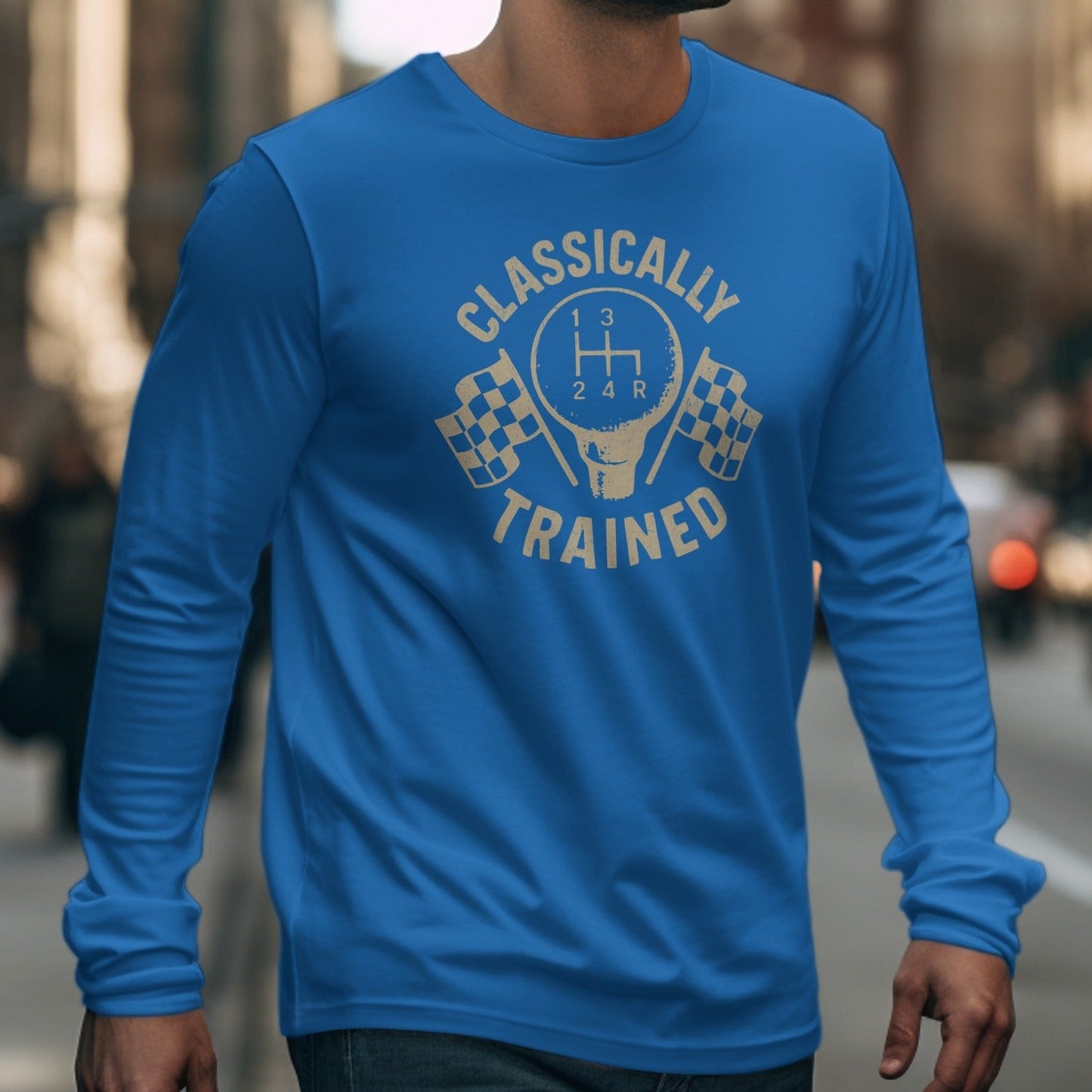 Blue long sleeve shirt with a graphic of a gear shift and checkered flags that reads "Classically Trained".