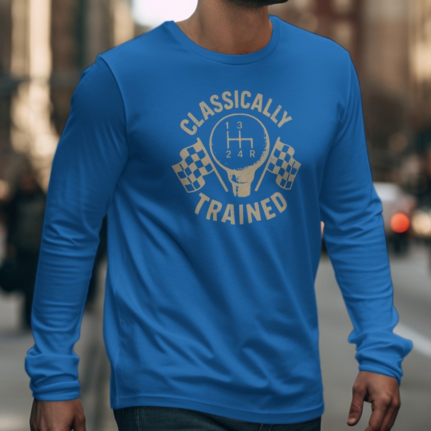 Blue long sleeve shirt with a graphic of a gear shift and checkered flags that reads "Classically Trained".