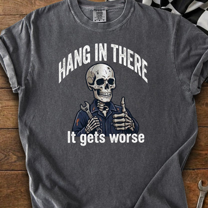Skeleton wearing overalls holds wrench and gives thumbs up, text "Hang in there" and "It gets worse."