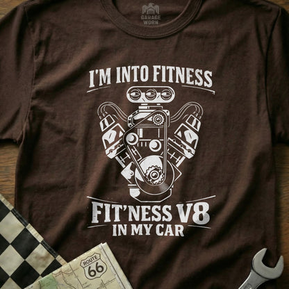 Brown t-shirt with white graphic of V8 engine and text "FIT'NESS V8 IN MY CAR".