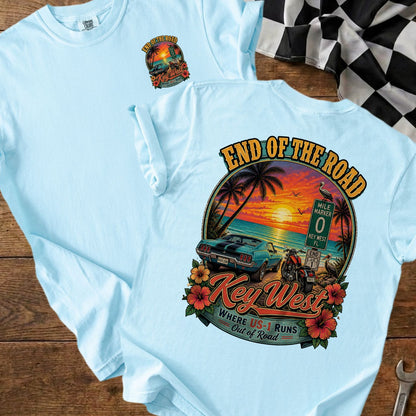 Light blue t-shirt with vintage Key West sunset graphic featuring car, motorcycle, and text.