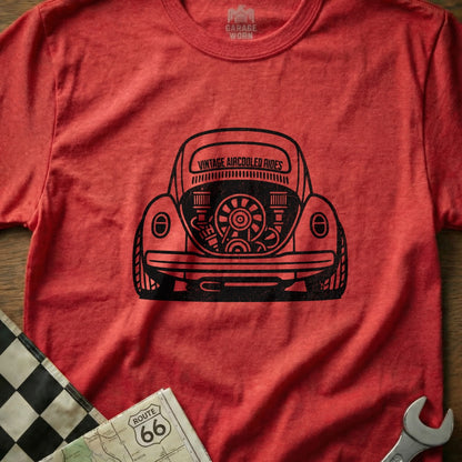 Red t-shirt with black graphic of a vintage air-cooled Volkswagen Beetle engine.