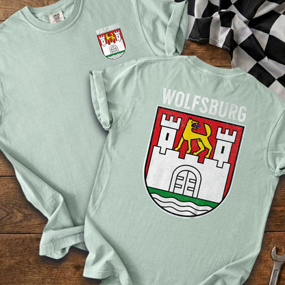 Light green t-shirts featuring the Wolfsburg crest and text.