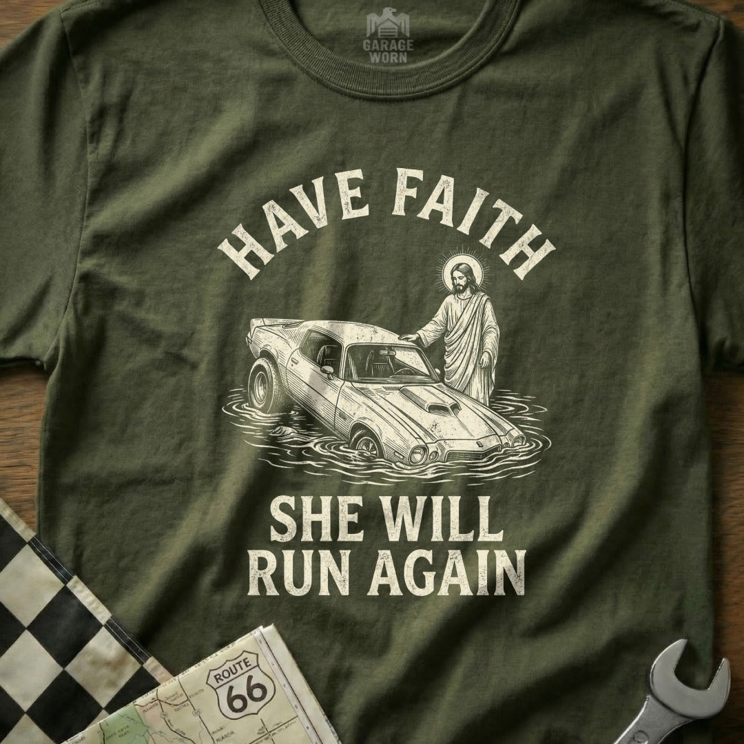 Green t-shirt with "HAVE FAITH SHE WILL RUN AGAIN" and Jesus pushing a car.